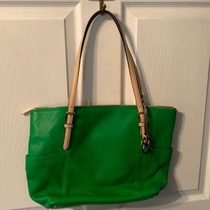 Michael Kors green leather bag.